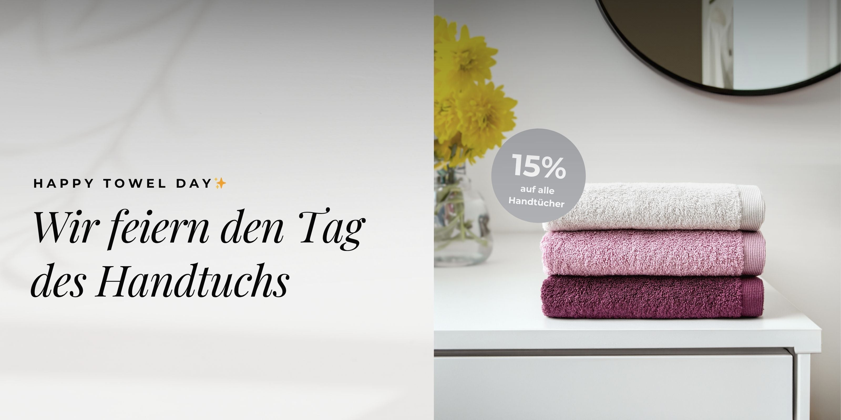 Banner zum Happy Towel Day mit Handtüchern und 15 % Rabattaktion