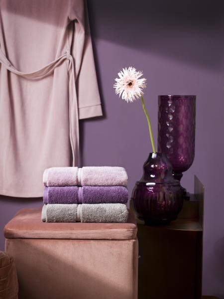 Dusky pink bathrobe, Purple vase, Flower, Pink stool, Stack of cloths